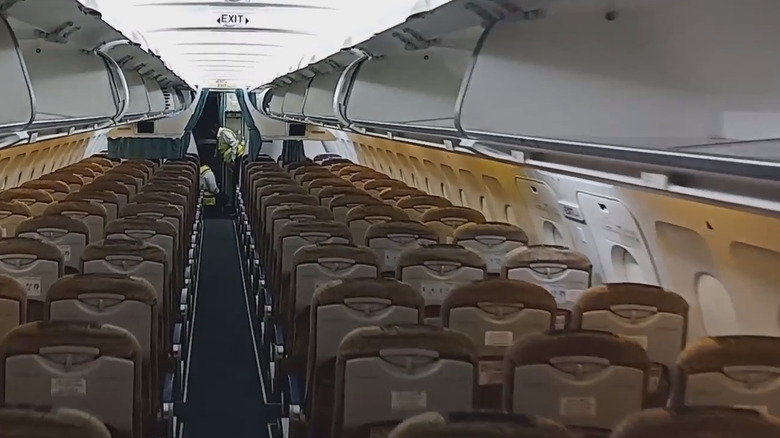 Inside a passanger aircraft with black triangle visible on the side window