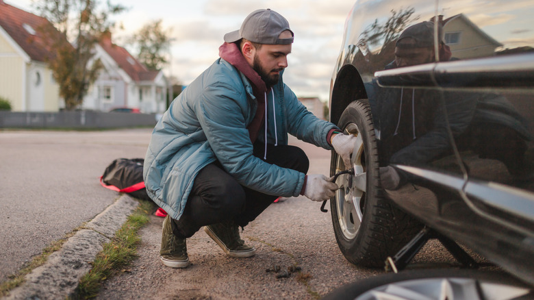 Man changing a flat tire