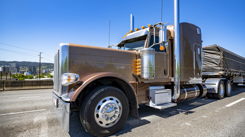 A Semi Truck With External Air Cleaner Visible On Driver's Side