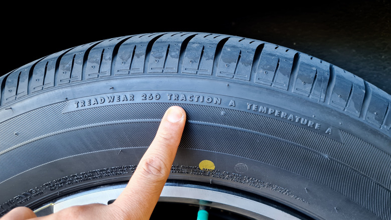 Tire sidewall information indicates treadwear, traction and temperature
