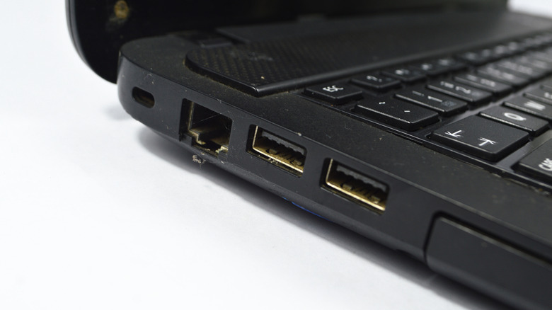 Close-up of a part of a laptop standing on a light background
