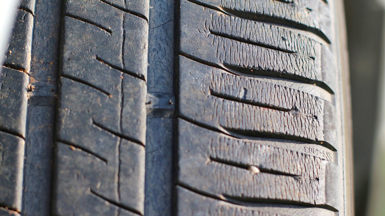 Tire zoomed in showing two tire wear bars