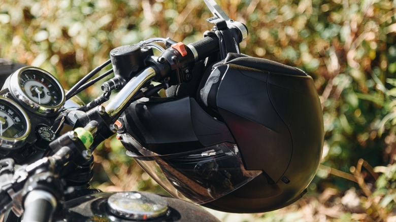 Hanging your helmet from the handlebars is one option for storage while away from the bike.