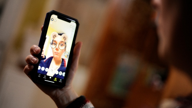 Person using a filter on Snapchat