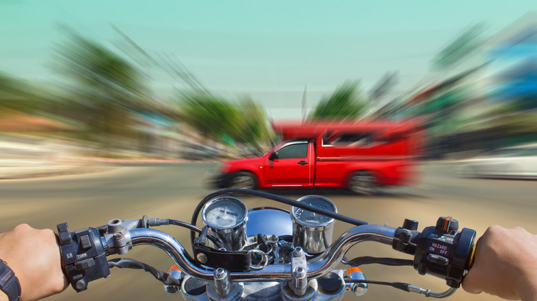 man riding motorcycle, accident imminent