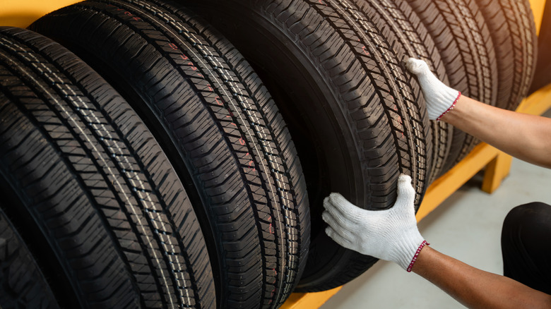 mechanic choosing tires