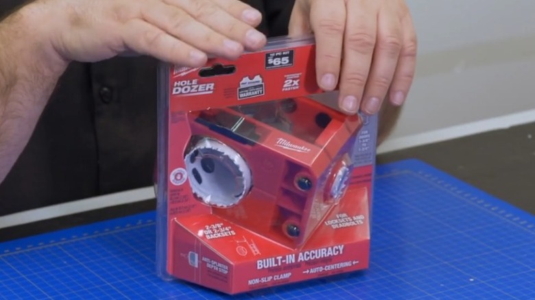 Mr. Locksmith holding Milwaukee Hole Dozer Door Lock Installation Kit