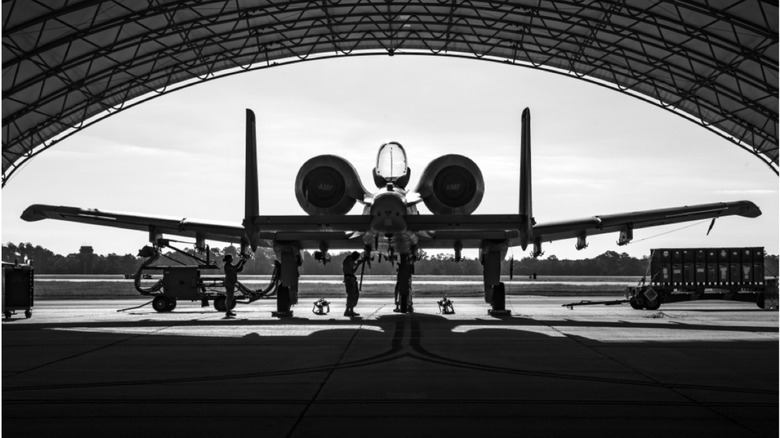 Black-and-white photo of an A-10 in a hanger