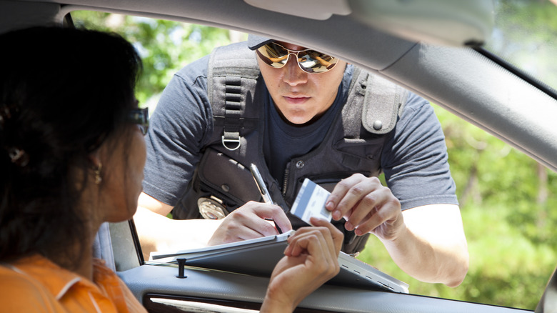 Police officer giving someone a ticket