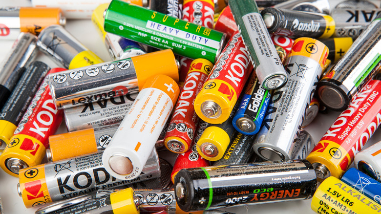 Various AA and AAA batteries lying in a pile