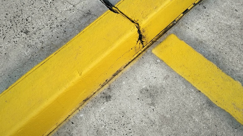 High-angle photo of a yellow curb