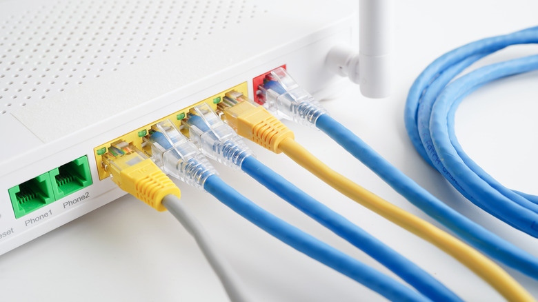 Ethernet cable with wireless router connect to internet service provider network.