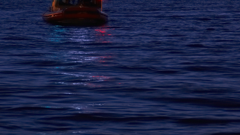 Ship with red and green lights in the dark