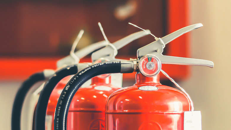 Tops of several fire extinguishers