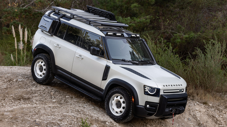 White Land Rover Defender on steep hill