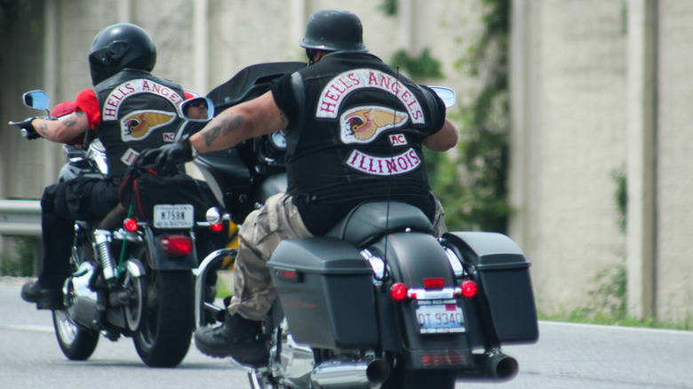 Hell's Angels riders wearing the club jackets riding bikes