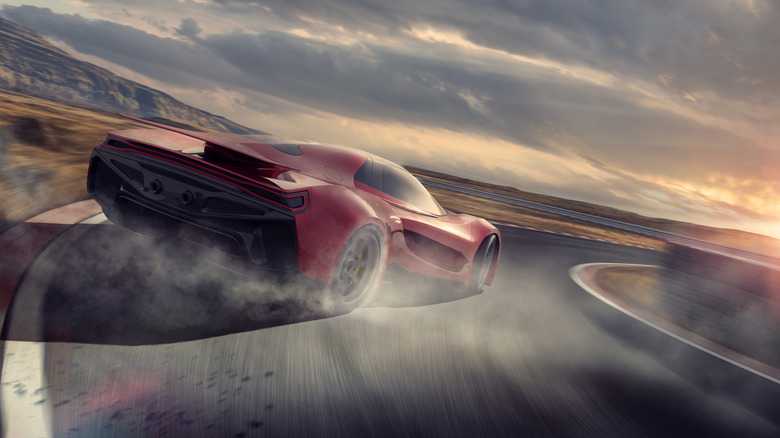 Car racing around track corner