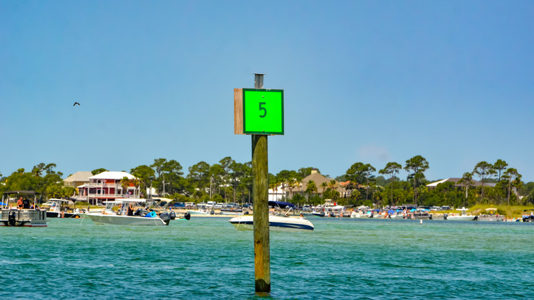 Green square channel marker placed near the coast