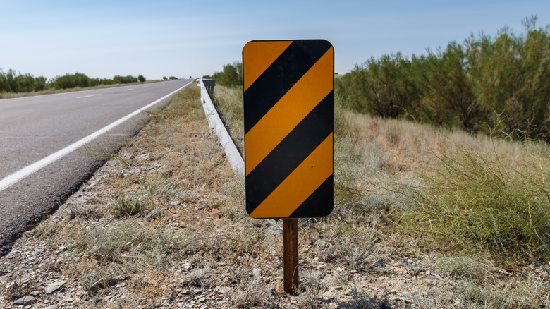 What Does A Diagonal Yellow And Black Striped Road Sign Mean?