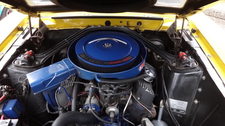 Yellow Shelby GT350 engine bay featuring 351 Windsor with blue accents