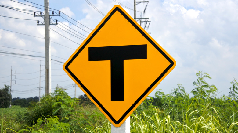 T-shaped intersection ahead warning sign on a road