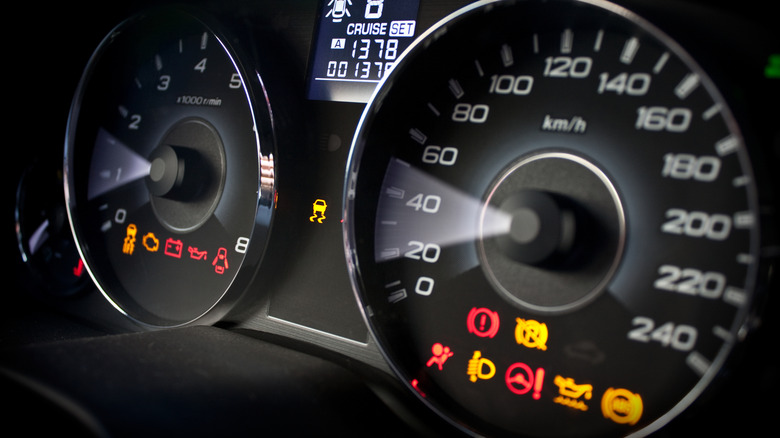 Car instrument panel with illuminated warning lights