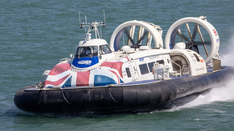 A hovercraft with the Union Jack painted on the front, cutting through the water