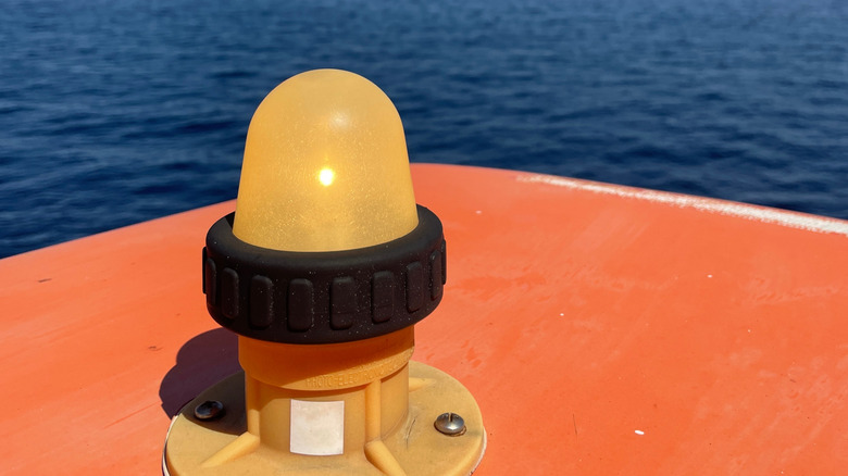 A close-up of a yellow light mounted on a boat