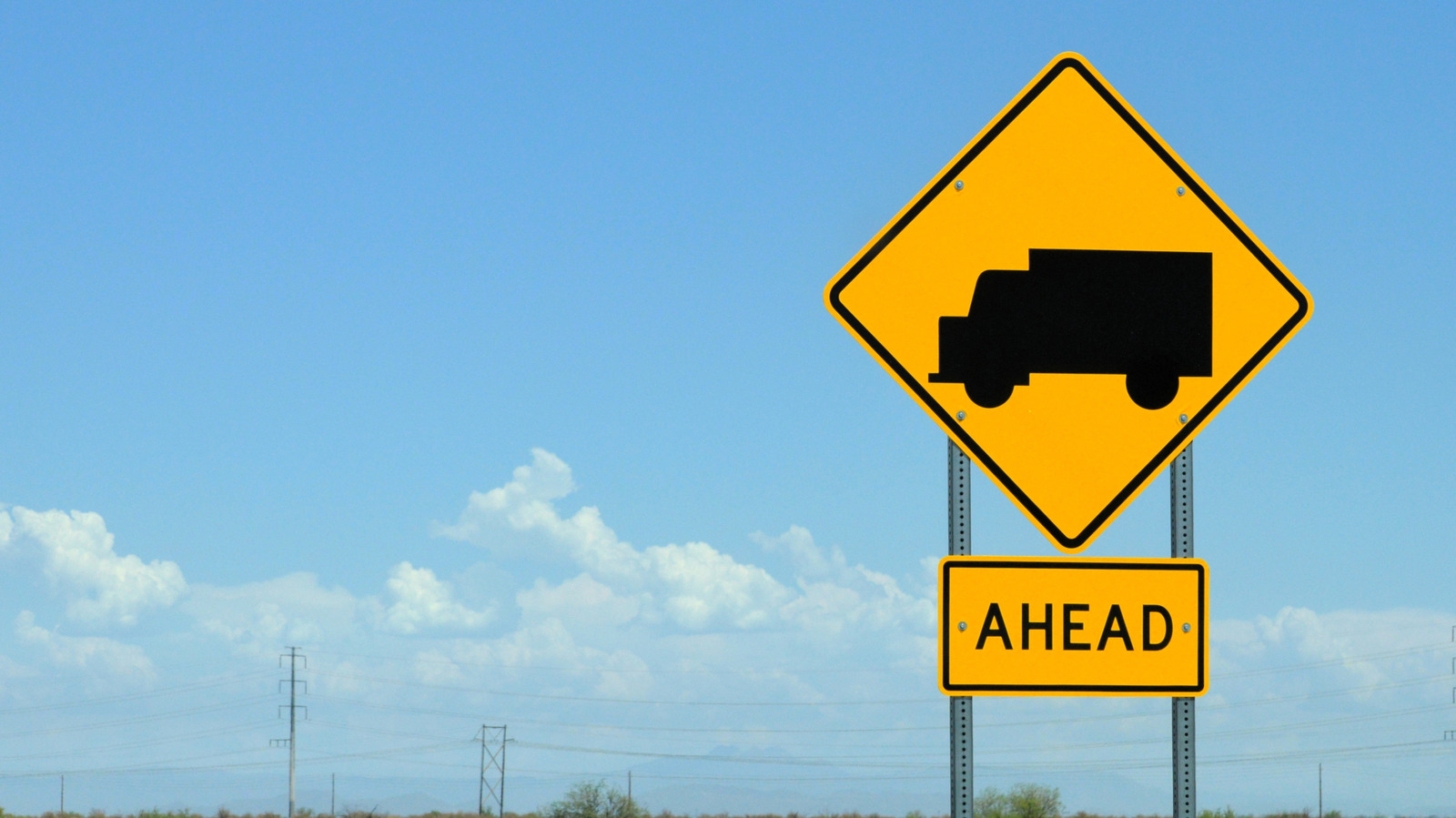 What a Yellow Road Sign With a Truck Means