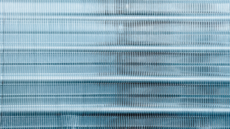 Close up aluminum fin of cooling condenser coil air condition system