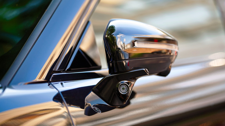 Modern vehicle with a camera in the wing mirror for blind-spot detection