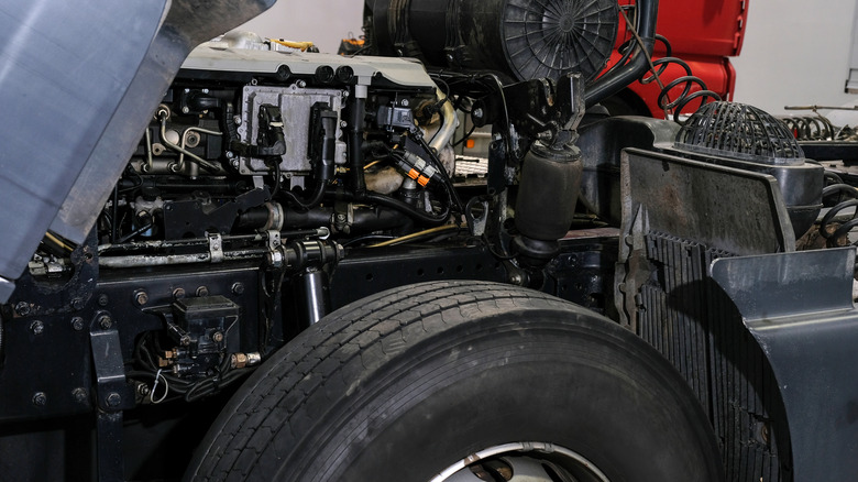 A truck's engine being repaired