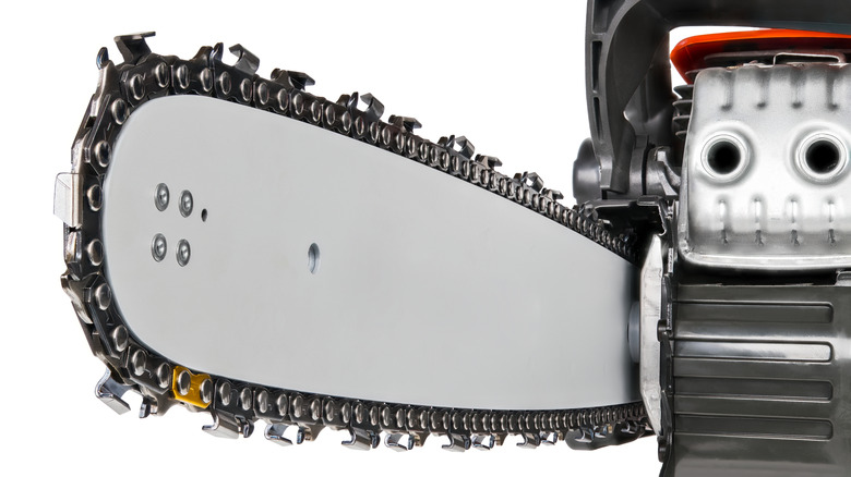 Close-up of a chainsaw blade on a guide bar