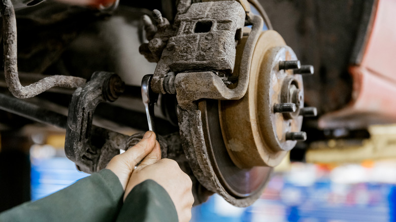 Mechanic working on car's brakes