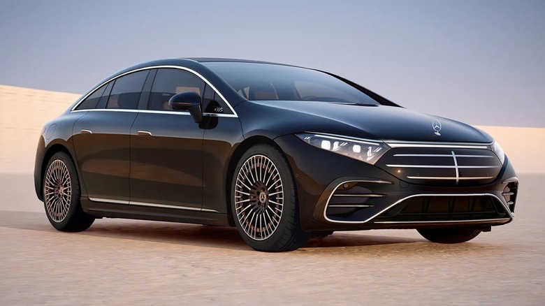 Front 3/4 shot a Mercedes-Benz EQS Sedan parked on sandy surface