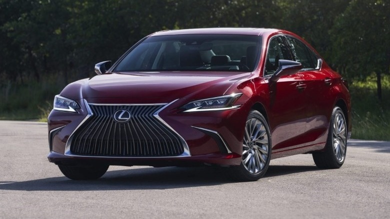 Lexus ES 250 AWD Luxury parked on the road with trees in the background
