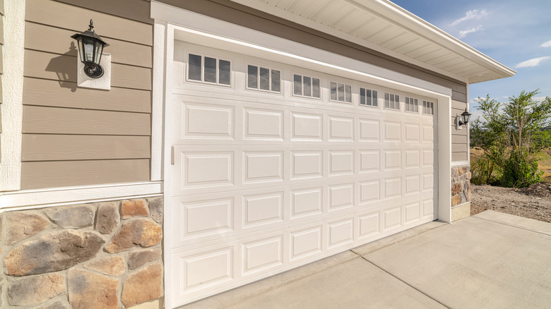 A white garage door on a sunny day