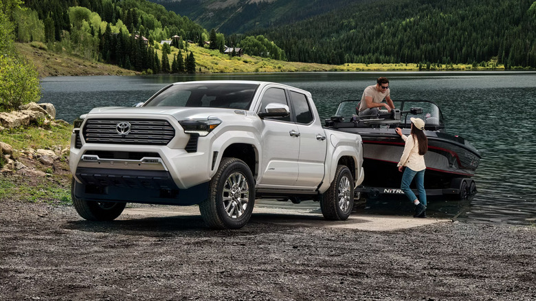2025 Toyota Tacoma hauls boat near lake