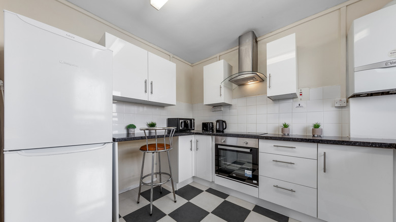 Fridge in white kitchen