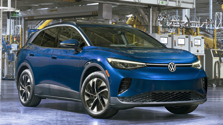 Front 3/4 view of blue Volkswagen ID.4 in factory