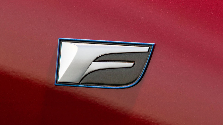 Lexus F badge on red Lexus IS F