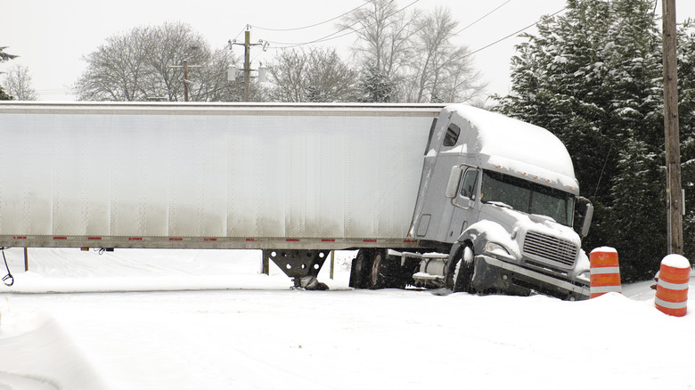jackknifed tractor-trailer stuck in snow
