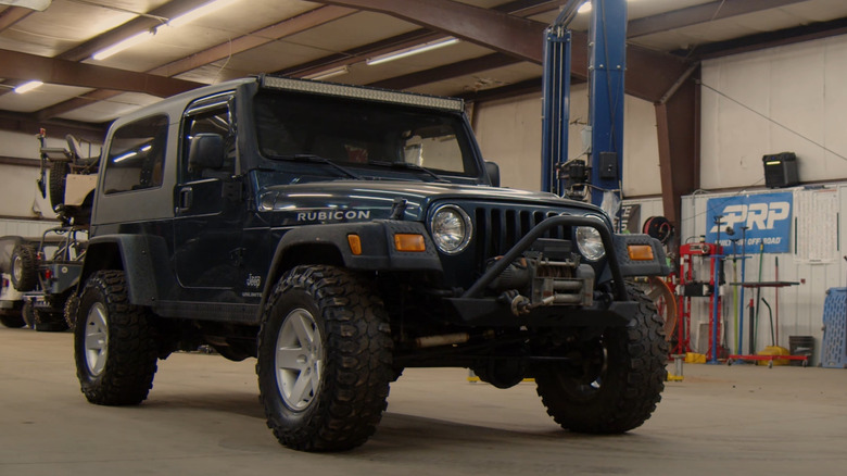Front-quarter view of a blue Jeep LJ Wrangler Rubicon