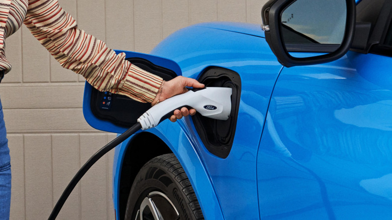 person charging 2023 Ford Mustang Mach-E GT