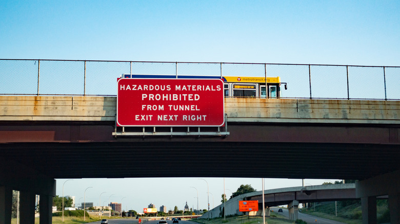 Hazardous Materials Prohibited sign above highway