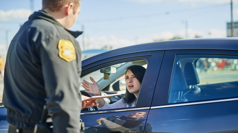 Car driver stopped by police for breaking traffic rules