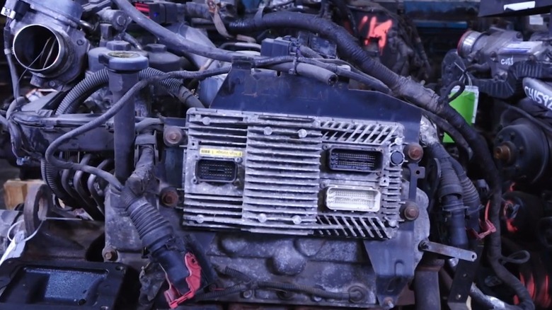 an image of an engine with an exposed ECM (engine control module)