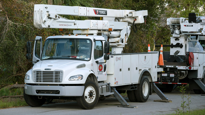 Utility truck parked with collapsed chair stand