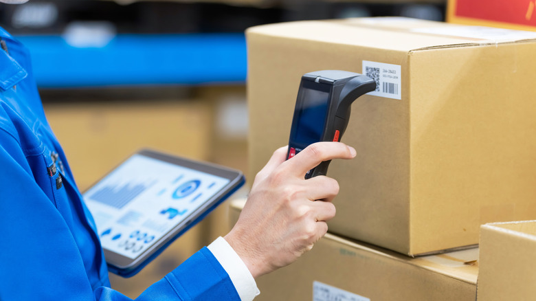 Person scanning a QR code in a factory
