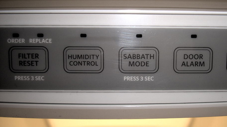 Close up a fridge control panel with a Sabbath Mode button clearly visible.